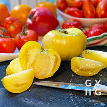 Load image into Gallery viewer, White Beauty Heirloom Tomato sliced open to show pulp to see ratio