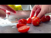 Load and play video in Gallery viewer, Here we slice open a couple of the Gardener's Sweetheart Cherry Tomatoes. They have a heart shape when sliced open.